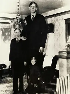 Gigantism Prints: Giant Robert Wadlow Standing With His Brothers