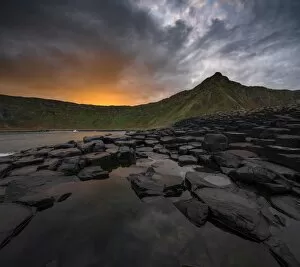 Images Dated 22nd October 2016: Giants Causeway with colorful sunrise looking towards the cliffs