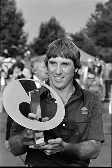 Gil Morgan Holding Trophy for Camera
