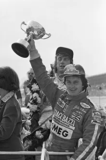 Gilles Villeneuve Holds Trophy Aloft