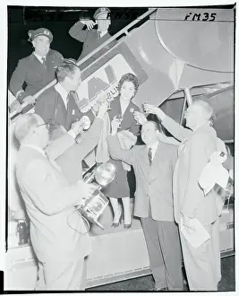 Gina Lollobrigida and Newsmen Drinking a Toast