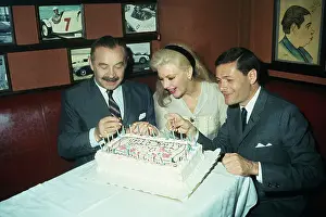 Ginger Rogers and Colleagues Lighting Candles on a Cake