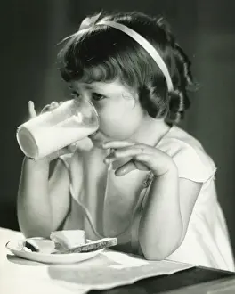 Sandwich Prints: Girl (4-5) having breakfast, (B&W)