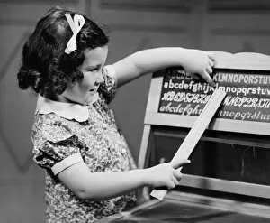 Aspirations Collection: Girl (4-5) learning alphabet (B&W)