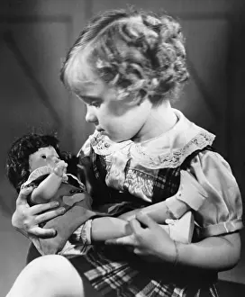 Kilt Prints: Girl (4-5) playing with doll (B&W)