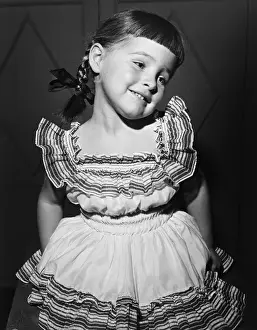 Girl (4-5) sitting at home, (B&W)