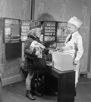 Dressing Up Prints: Girl (8-9) and boy (8-9) playing doctor and patient