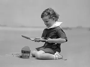 Wavy Hair Prints: Girl (8-9 years) palying on beach. Narragansett, Rhode Island, USA. July 22, 1914
