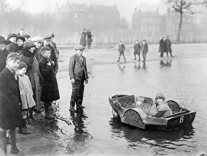 Raft Prints: Girl (8-9 years) in propelled boat in park