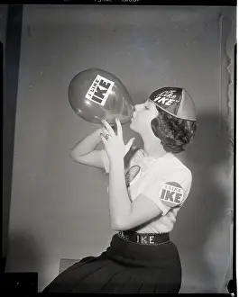 Belt Prints: Girl Blows Up Balloon With Ike On It