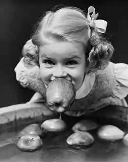 Blond Hair Prints: Girl bobbing apples at Halloween party