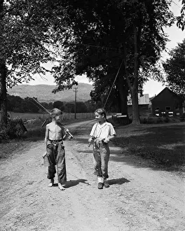 Unpaved Road Prints: Girl and Boy Holding Fishing Poles