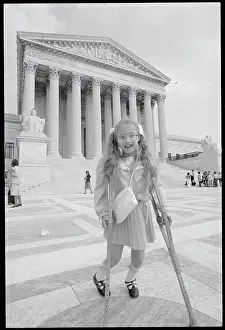 Girl on Crutches Outside of Supreme Court