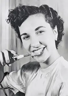 Manual Prints: Girl Demonstrating Rotary Toothbrush