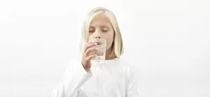 Nourishment Collection: Girl drinking a glass of water