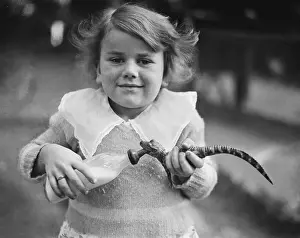 Alligator Prints: Girl Feeding Young Alligator with Small Bottle