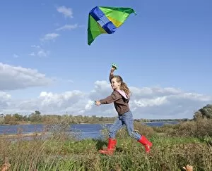 Climbing Collection: Girl flying a kite, kiteflying, Hitzacker, Lower Saxony, Germany, Europe