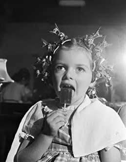 Licking Prints: Girl With Hair Curlers Licking Lollipop