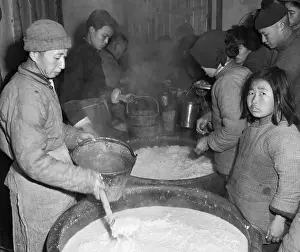 Girl Having Bucket Filled with Soup