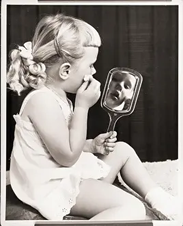 Girl Holding a Mirror