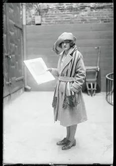 Girl Holding a Photograph