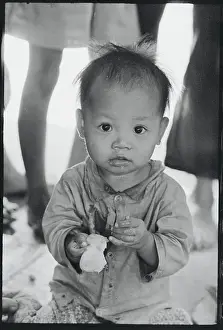 Girl Holding Piece of Grapefruit