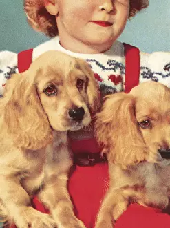 Girl Holding Two Puppies