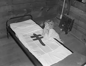 Girl Kneeling to Pray Beside Her Bed