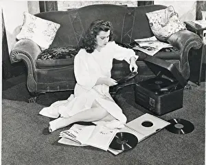 Girl Listens To Music, Reads Magazines
