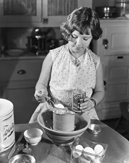 Girl Mixing Food in Kitchen