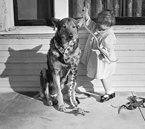 Long Beach Prints: Girl Playing with Snakes Alongside Her Dog