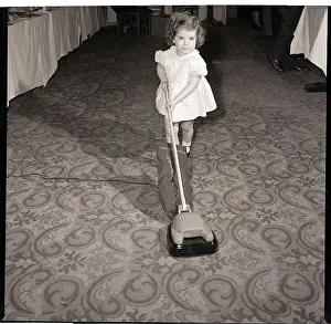 Carpet Prints: Girl Playing with Toy Vacuum Cleaner