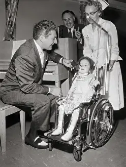 Poliomyelitis Prints: Girl with Polio Throwing Switch Held by Liberace