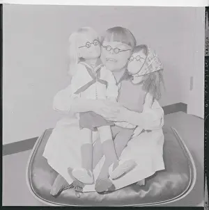Girl Posing with Dolls