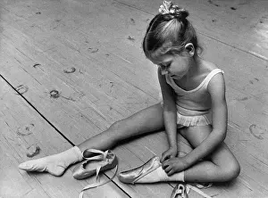Ballerina Prints: Girl Putting On Ballet Slippers