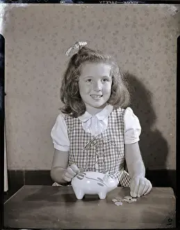 Responsibility Prints: Girl Putting Money In Piggy Bank