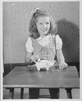 Responsibility Prints: Girl Putting Money In Piggy Bank