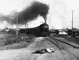 Fainting Prints: Girl on Railroad Tracks in Silent Movie Still