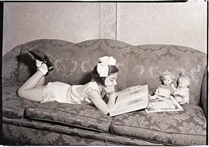 Girl Reading on Sofa