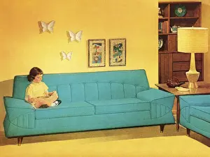 Girl Reading On Turquoise Couch