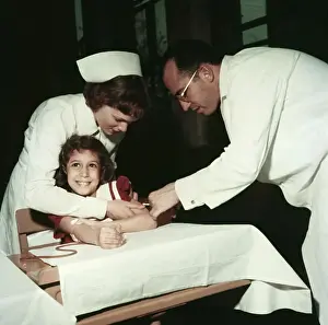 Girl Receiving Polio Vaccine from Jonas Salk