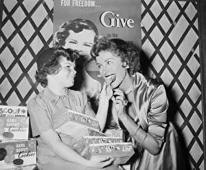 10 12 Years Prints: Girl Scout Giving Cookie To Jinx Falkenburg