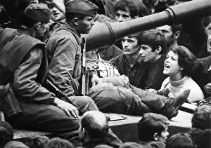 Girl Shouts To Soldiers Seated On Tanks