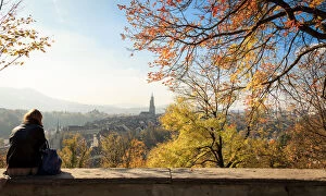 Images Dated 31st October 2013: A girl sitting to enjoy scenery of the Old City of Bern at rose garden