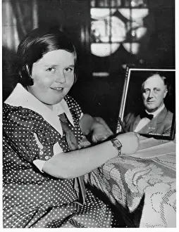 Franklin D Prints: Girl Sitting with Picture of President Roosevelt