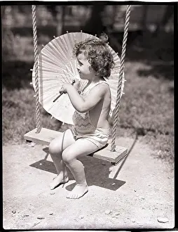 Parasol Prints: Girl on Swing Holding Parasol