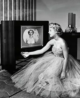Broadcasting Prints: Girl Tuning In Color TV Broadcast