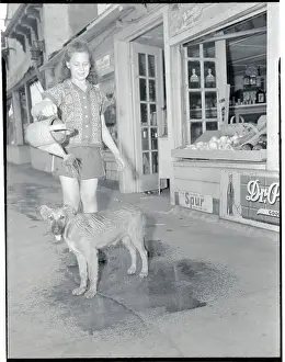 Relief Prints: Girl Using Watering Pot to Cool Her Dog from the Heat