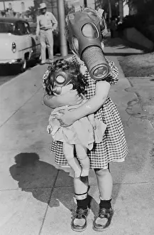 Pre Teen Girl Prints: Girl Wearing a Muzzled Mask and Holding a Doll