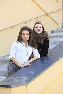 Images Dated 29th March 2014: Two girlfriends, teenagers, posing on a staircase, Menton, Alpes-Maritimes